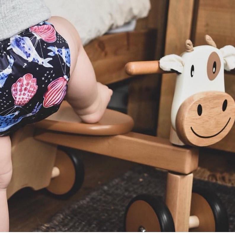 Wooden cow hot sale ride on